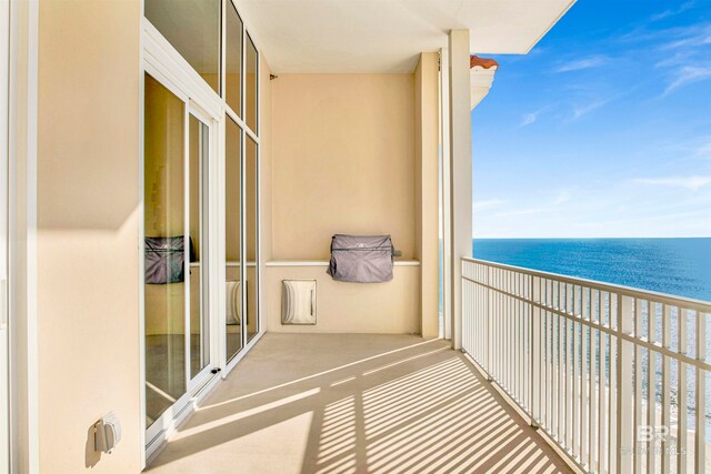 balcony with a view of the beach and a water view