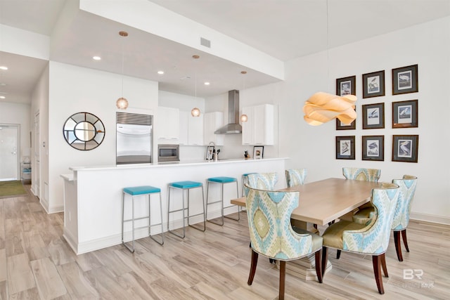 dining area featuring light hardwood / wood-style flooring