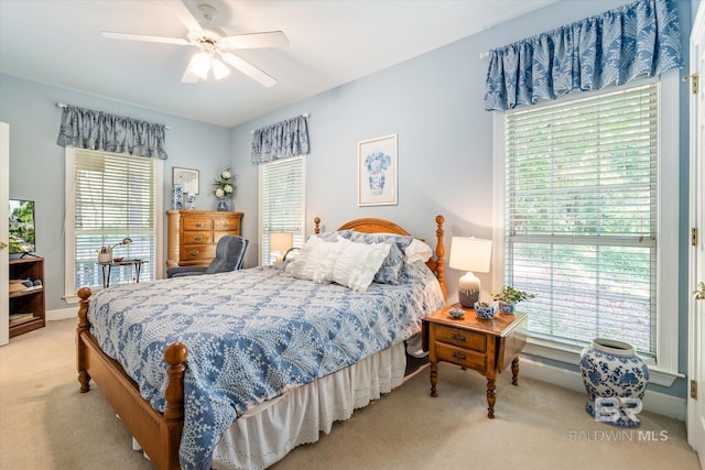 carpeted bedroom featuring ceiling fan