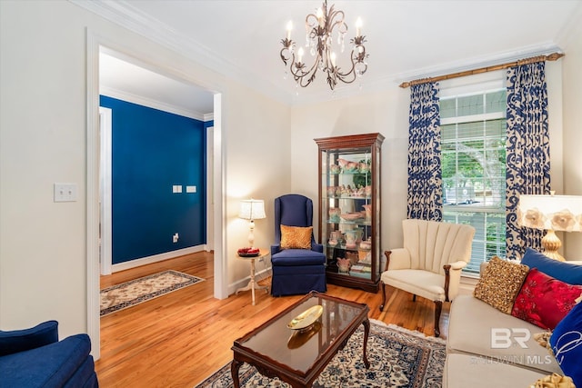 living room with a chandelier, wood-type flooring, and crown molding