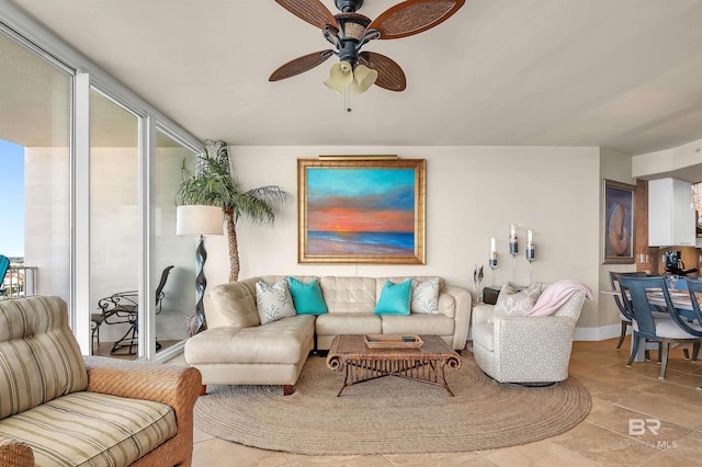 28107 Perdido Beach Blvd Unit D1005, Orange Beach, AL 36561 - living area with a ceiling fan, plenty of natural light, and tile patterned flooring