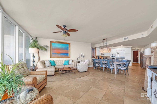 28107 Perdido Beach Blvd Unit D1005, Orange Beach, AL 36561 - living area featuring a ceiling fan and baseboards