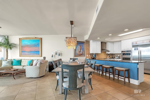 28107 Perdido Beach Blvd Unit D1005, Orange Beach, AL 36561 - dining area with light tile patterned floors, a chandelier, and recessed lighting