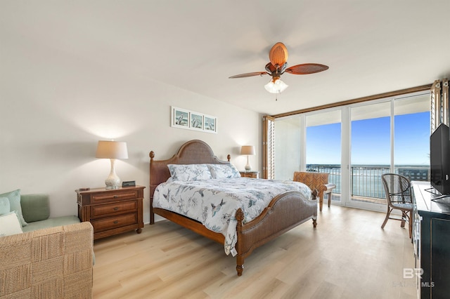 28107 Perdido Beach Blvd Unit D1005, Orange Beach, AL 36561 - bedroom featuring access to exterior, light wood-type flooring, floor to ceiling windows, and a ceiling fan