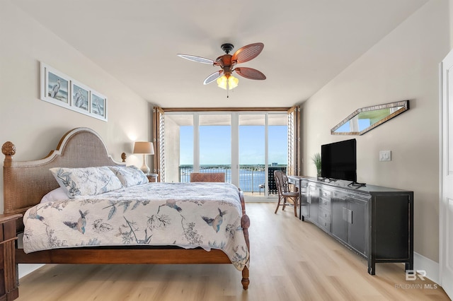28107 Perdido Beach Blvd Unit D1005, Orange Beach, AL 36561 - bedroom with access to outside, light wood-type flooring, expansive windows, and a ceiling fan