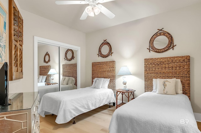 28107 Perdido Beach Blvd Unit D1005, Orange Beach, AL 36561 - bedroom featuring light wood-type flooring, a ceiling fan, and a closet