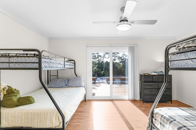 bedroom with ceiling fan, ornamental molding, and hardwood / wood-style flooring