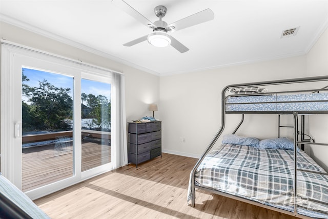 bedroom with ceiling fan, access to exterior, light wood-type flooring, and ornamental molding