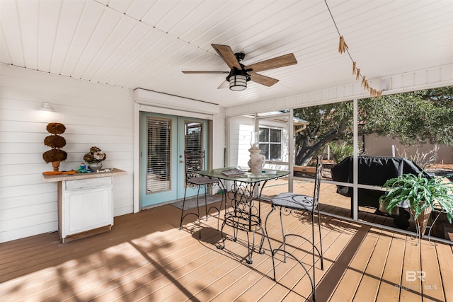 wooden terrace featuring ceiling fan