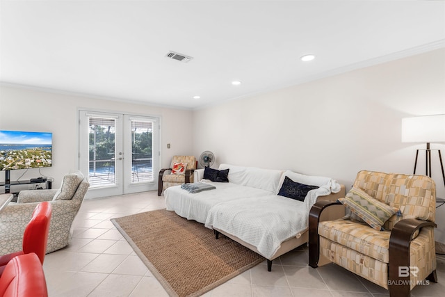 tiled bedroom featuring access to exterior, french doors, and ornamental molding