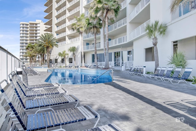 community pool featuring a patio area