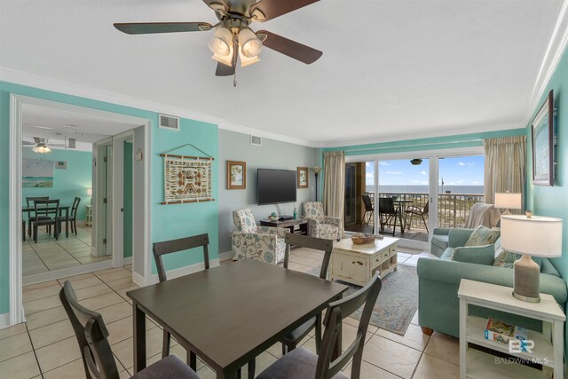 615 W Beach Blvd Unit 1E, Gulf Shores, AL 36542 - dining area featuring a ceiling fan, light tile patterned flooring, crown molding, and baseboards