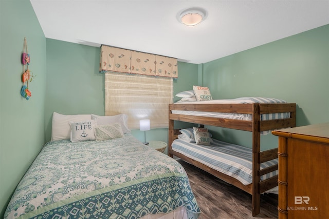 615 W Beach Blvd Unit 1E, Gulf Shores, AL 36542 - bedroom with dark wood-style flooring