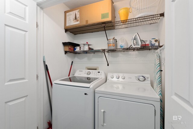 615 W Beach Blvd Unit 1E, Gulf Shores, AL 36542 - laundry room with separate washer and dryer