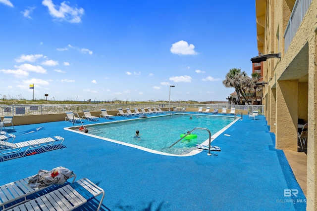 615 W Beach Blvd Unit 1E, Gulf Shores, AL 36542 - community pool featuring a patio