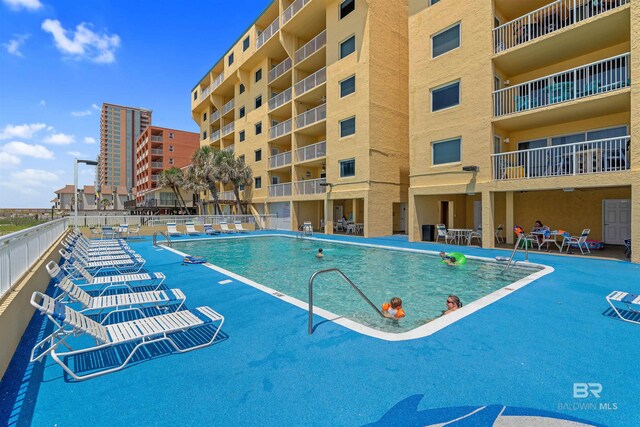 615 W Beach Blvd Unit 1E, Gulf Shores, AL 36542 - community pool featuring a patio