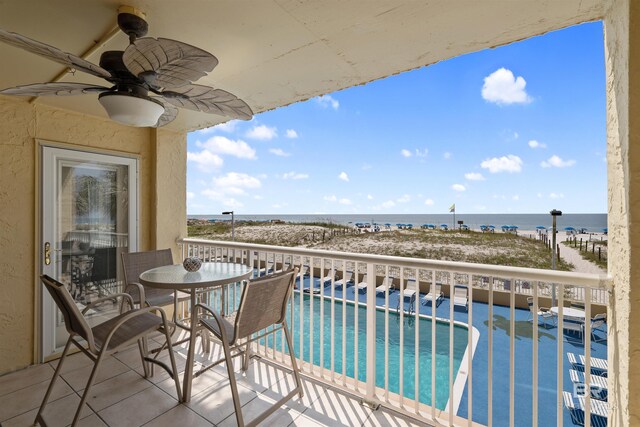 615 W Beach Blvd Unit 1E, Gulf Shores, AL 36542 - balcony with a ceiling fan, a water view, and view of pool