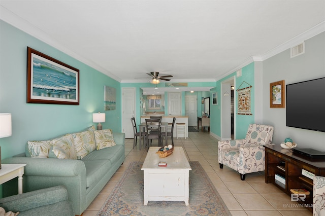 615 W Beach Blvd Unit 1E, Gulf Shores, AL 36542 - living room featuring light tile patterned floors, ornamental molding, and ceiling fan
