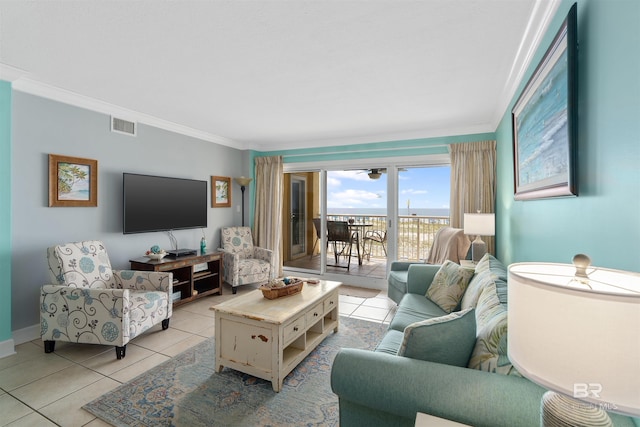 615 W Beach Blvd Unit 1E, Gulf Shores, AL 36542 - living room featuring ornamental molding, light tile patterned floors, a ceiling fan, and baseboards