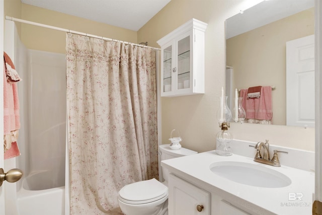 full bathroom featuring vanity, shower / bathtub combination with curtain, and toilet