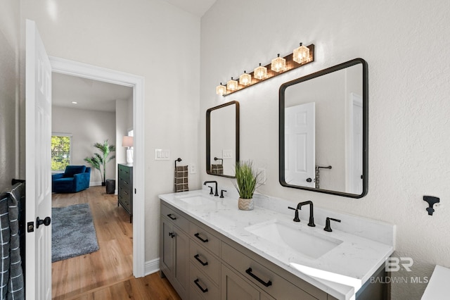 bathroom featuring hardwood / wood-style flooring and vanity