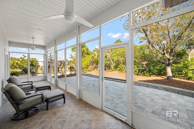 sunroom / solarium with ceiling fan