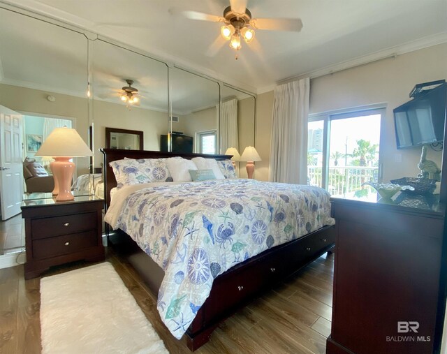 1010 W Beach Blvd Unit 209, Gulf Shores, AL 36542 - bedroom featuring ornamental molding, wood finished floors, and a ceiling fan