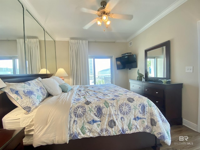 1010 W Beach Blvd Unit 209, Gulf Shores, AL 36542 - bedroom featuring wood finished floors, ornamental molding, baseboards, and ceiling fan