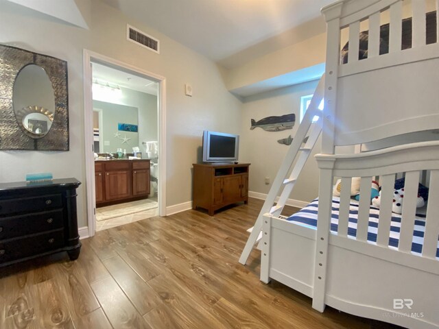 1010 W Beach Blvd Unit 209, Gulf Shores, AL 36542 - bedroom featuring wood finished floors and baseboards
