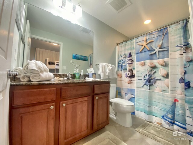 1010 W Beach Blvd Unit 209, Gulf Shores, AL 36542 - bathroom with tile patterned floors, vanity, toilet, a shower with curtain, and recessed lighting