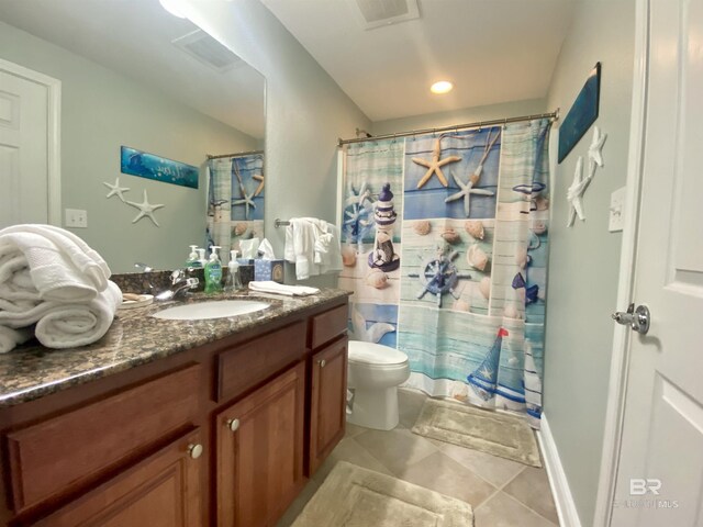 1010 W Beach Blvd Unit 209, Gulf Shores, AL 36542 - full bath with toilet, vanity, a shower with shower curtain, and tile patterned floors