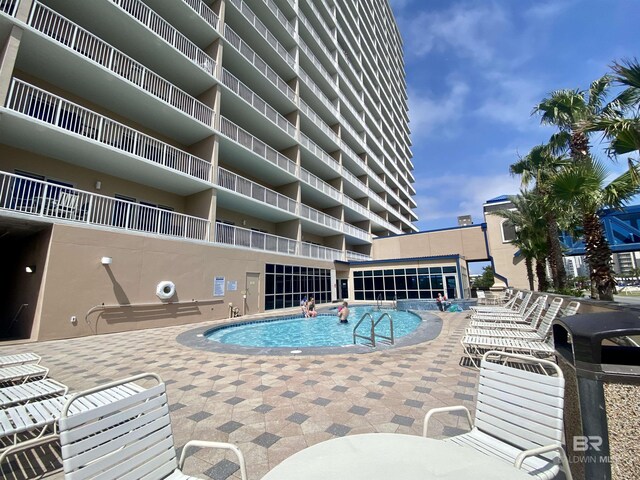 1010 W Beach Blvd Unit 209, Gulf Shores, AL 36542 - community pool featuring a patio