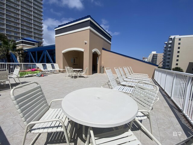 1010 W Beach Blvd Unit 209, Gulf Shores, AL 36542 - view of patio with outdoor dining area