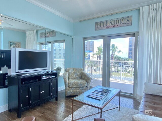 1010 W Beach Blvd Unit 209, Gulf Shores, AL 36542 - living area featuring ornamental molding and dark wood-type flooring
