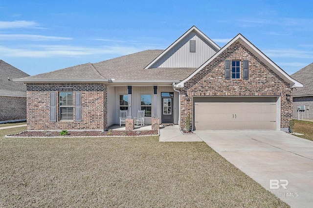 view of front facade with concrete driveway, brick siding, a front lawn, and roof with shingles