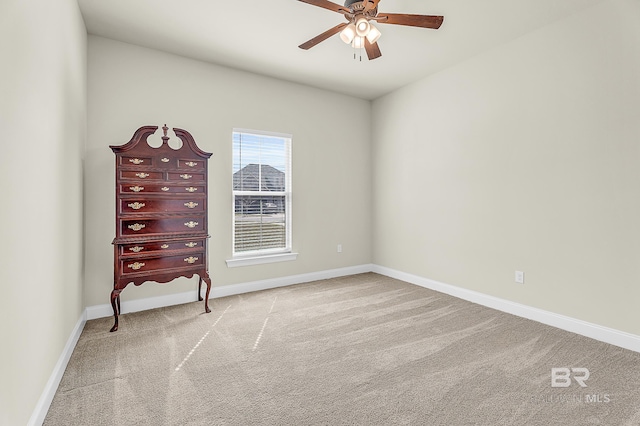 unfurnished bedroom with carpet floors, ceiling fan, and baseboards