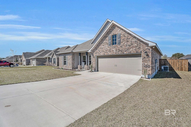 view of front of home with central air condition unit, brick siding, fence, driveway, and a front lawn