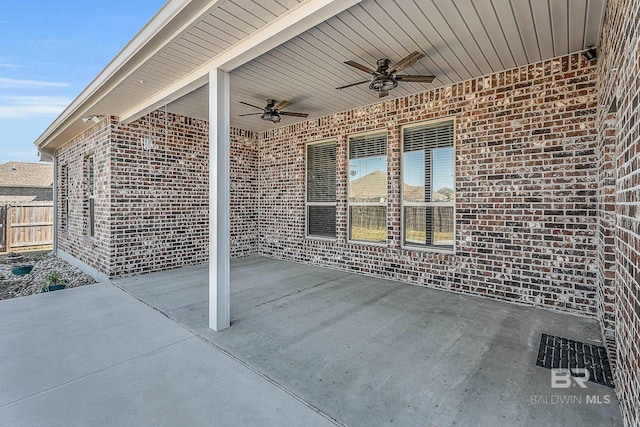 view of patio / terrace featuring fence and a ceiling fan