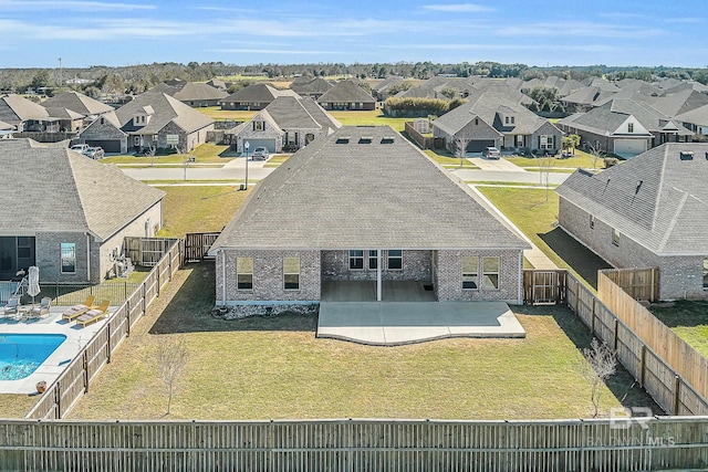 birds eye view of property with a residential view