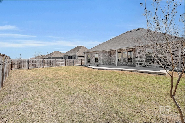 view of yard featuring a patio and a fenced backyard