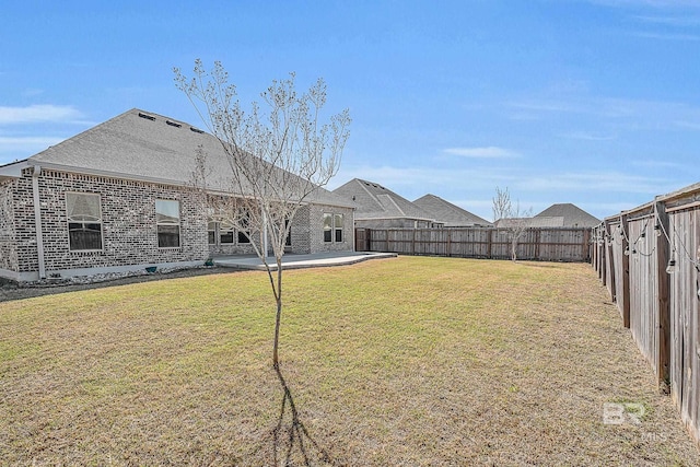 view of yard featuring a fenced backyard and a patio