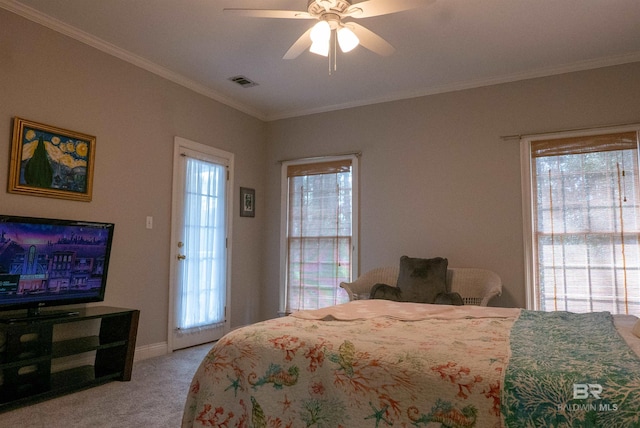 bedroom with crown molding, light colored carpet, and ceiling fan