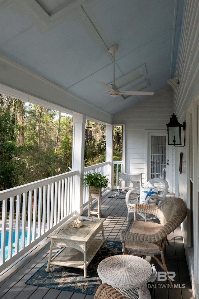 wooden terrace featuring ceiling fan