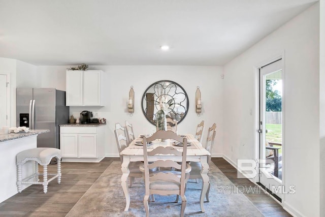 dining room with dark hardwood / wood-style flooring