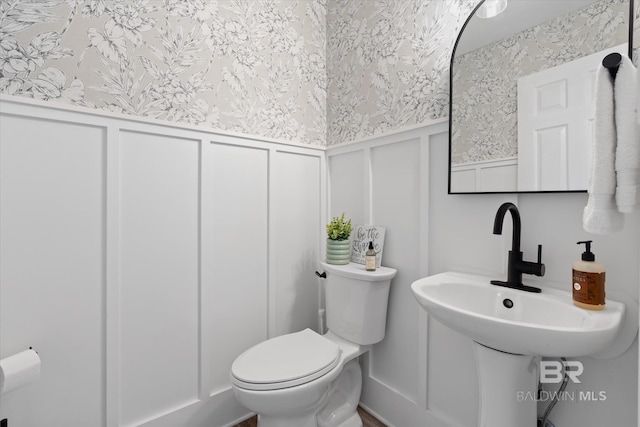 bathroom featuring sink and toilet