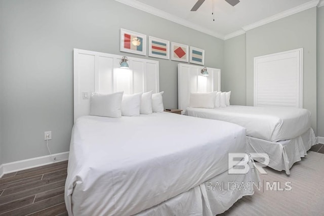 bedroom featuring baseboards, ornamental molding, a ceiling fan, and wood finished floors