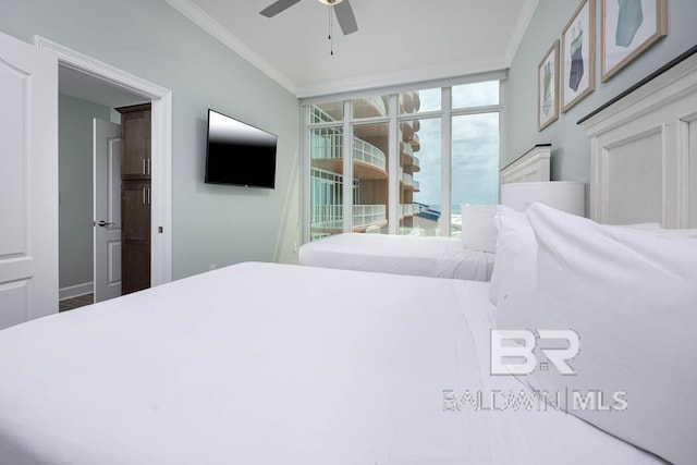bedroom featuring access to outside, ceiling fan, and ornamental molding