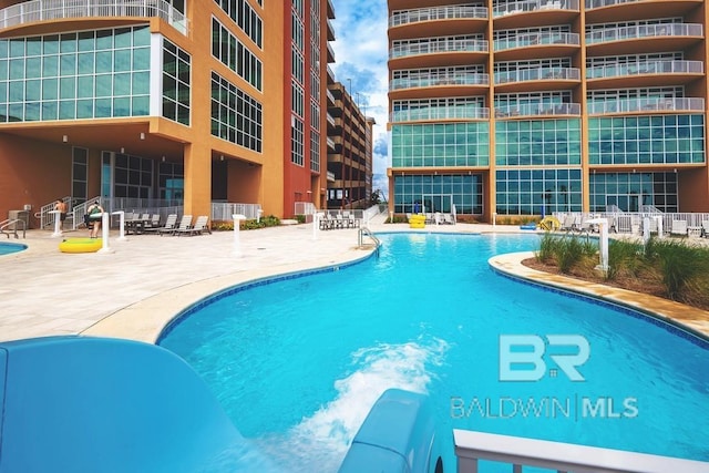 pool with a patio area
