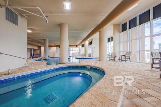 pool with an indoor hot tub