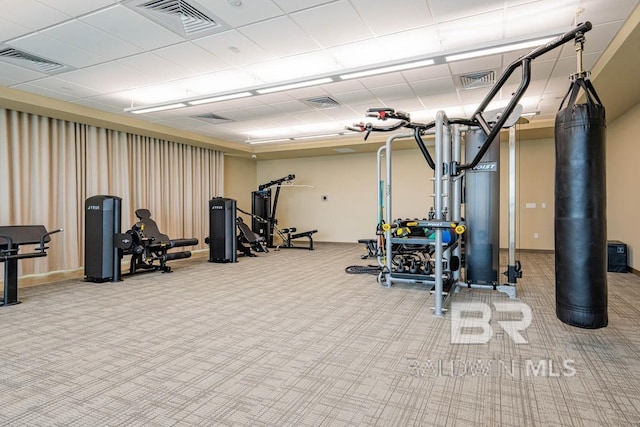 exercise room with visible vents and carpet flooring